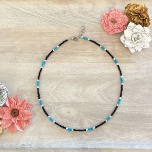 Necklace. Size 16.5”. Color teal, black, and white